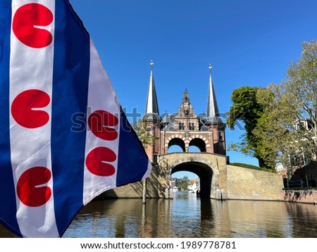 Frisian flag in front of the watergate in Sneek, Friesland The Netherlands