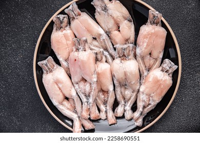 frog leg frozen meat frozen food meal food snack on the table copy space food background rustic top view - Shutterstock ID 2258690551