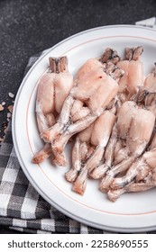 frog leg frozen meat frozen food meal food snack on the table copy space food background rustic top view - Shutterstock ID 2258690555