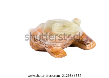 A frog made of onyx bringing good luck. Isolated over white bakcground. Close-up.