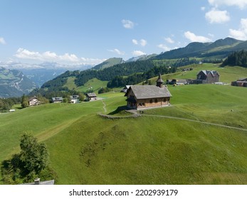 Fronalpstock Klingenstock wooden chapel in Stoos in central Switzerland a small wintersport ski resort village. Grassland alps alpine town on a clear sunny summer day. Clear mountain air and sky.