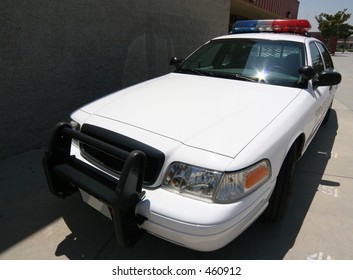 Front Angle Of Modern Police Car On Campus