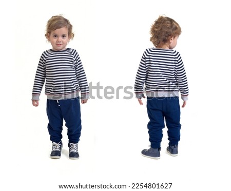 front and back view of same baby boy standing on white background