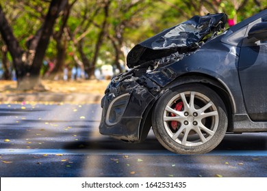 Front of black color car big damaged and broken by accident on city street parking can not drive any more. With copy space for text or design - Shutterstock ID 1642531435