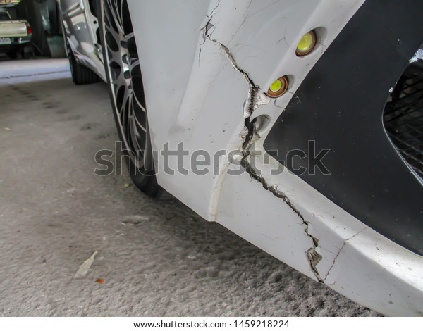 Front bumper car crash\
damage./front bumper car made of fiberglass damaged from the\
accident.