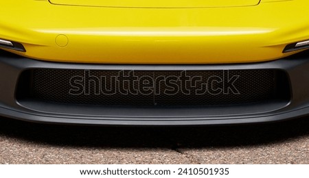 Front bumper on a yellow sports car