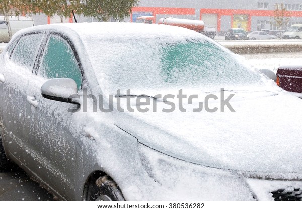 The\
front of the car - the bonnet, under a layer of\
snow