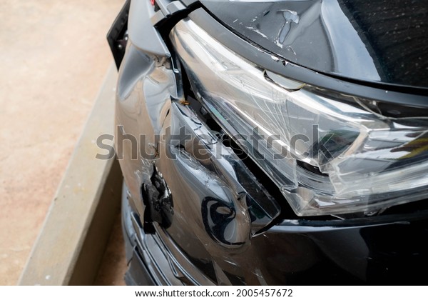 The front\
car was broken after a road accident, the headlights and front\
parts were broken, accident,\
insurance