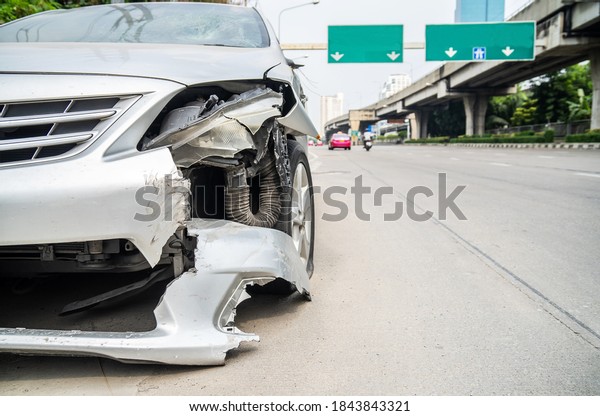 Front of car crash get damaged by\
accident on the road in the city, damaged\
automobiles