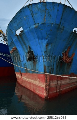 front of cargo ship with anchor when docked at the port of loading and unloading goods