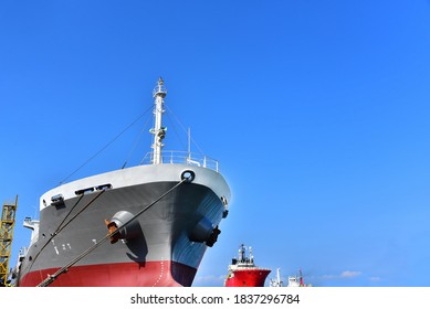 Front Of Cargo Ship, Prow Front Close Up View Of Ocean Liner, Freight Ship Or Cargo Vessel Anchored Or Moored At Pier Of Harbor.