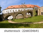 Front of the castle in Decin, Czech Republic, with entrance bridge and stone walls
