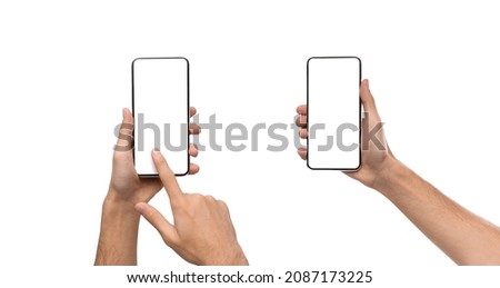 Front closeup of male hands holding smart phones with white empty screen, showing using devices, person sharing media transfer data files, touching monitor, free copy space. Banner, studio mock up Imagine de stoc © 