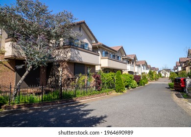 A Front Corner View Of A Row Of New Houses.