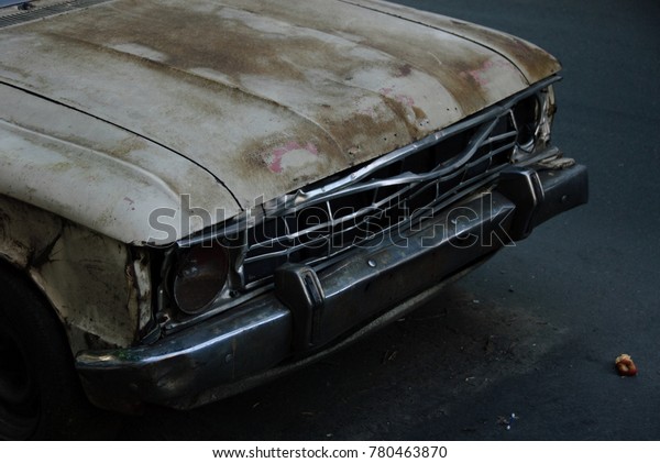 Front of\
Damaged and Rusting Old Car,\
Argentina