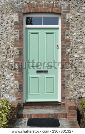 Front door of a beautiful old house on a street in an English town