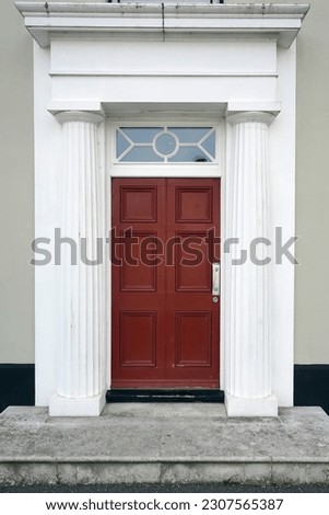 Front door of a beautiful old town house on a street in an English city