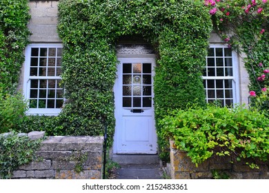 Front door and exterior of a beautiful old house on a street in an English town - Powered by Shutterstock