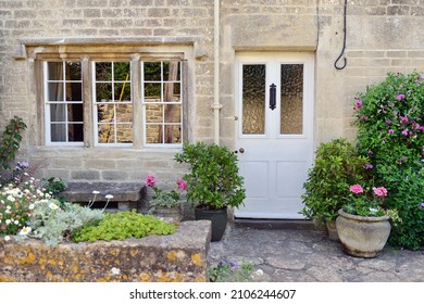 Front Door, Exterior And Garden Of A Beautiful Old Cottage House