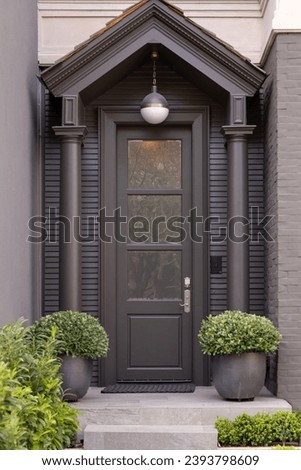 Front door, Flat black front door with a timeless design.