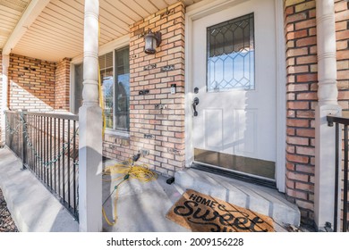 Front Door With Ornate Glass Panel And A Home Sweet Home Doormat