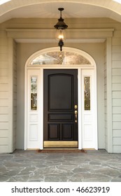 Front Door And Porch To A Family Residence. Vertical Shot.