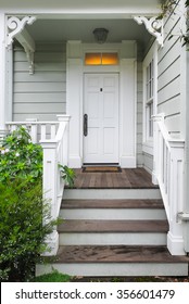 Front door and porch of a Victorian house or cottage