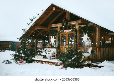 Front Door Porch Of Village Countryside House With Swing Hammock Decorated For Christmas Winter Holidays, Christmas And New Year Vacation Concept