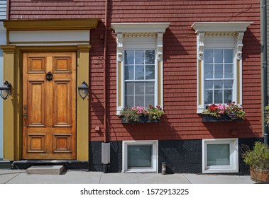 Front Door And Windows Of Old Clapboard House