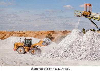Front end loader and gypsum stock pile