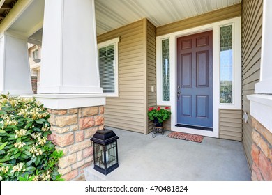 Front Entry Door With Concrete Floor Porch And Flowers Pot. Northwest, USA