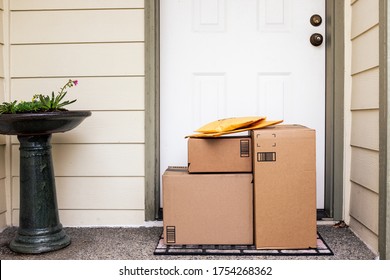 Front Entryway Of House With Stack Of Delivery Boxes From Online Ordering And E-commerce