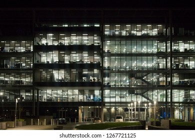 Front Facade Of Modern Office Building At Night