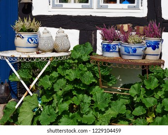 In Front Facade Of A Traditional Country Style Danish House With Flowers, Pots And Garden Tables Denmark