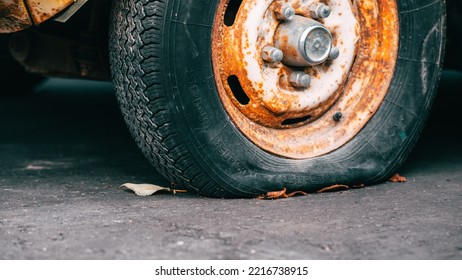 Front Flat Tire On An Old Rusty Car