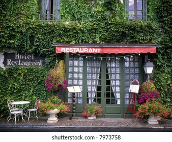 Front Of A French Restaurant With Menu Boards