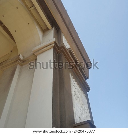 the front of the gate under the blue sky