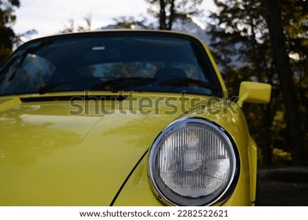 Front of a German collection car, old or vintage car of yellow color