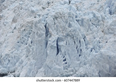 front of a glacier structured with cracks