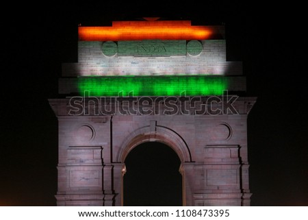 Front half view of epic India Gate New Delhi displaying Indian tricolour national  flag with   lights on the top it
