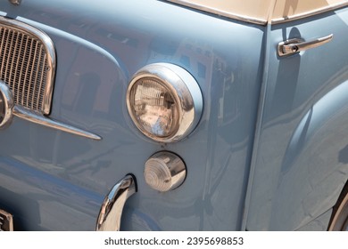 front headlight view of vintage blue retro car Old School van head light - Powered by Shutterstock