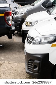 front of a line of vans