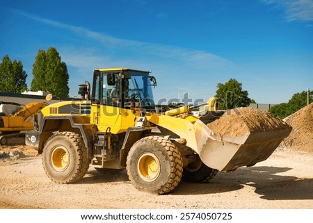 Front loader in action on a construction site