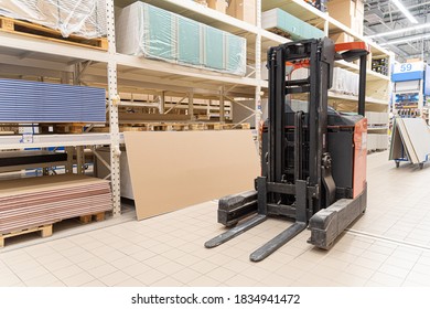 
Front loader among the racks in the warehouse.