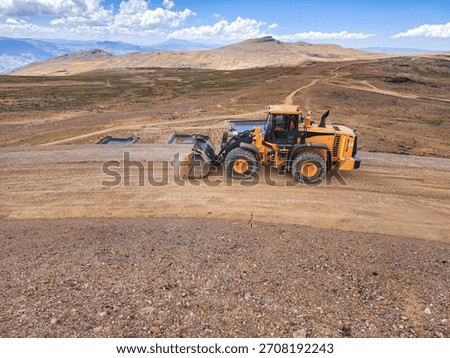 front loader leveling and profiling benches in mine
