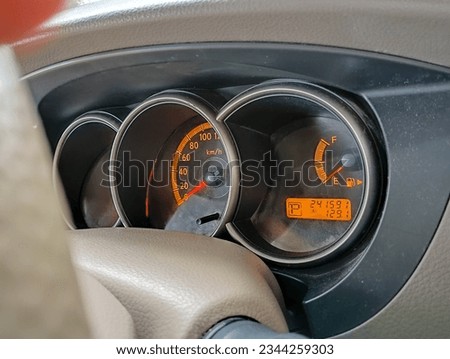 front look of Speedometer on a modern car dashboard. close up.