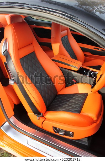 Front luxury car seat. Orange car interior. Car.\
Tuning. Orange luxury car. Supercar. Orange. England. Tuning.\
Karbon. Europe. Leather.