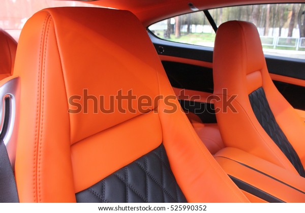 Front luxury car seat.\
orange. Car