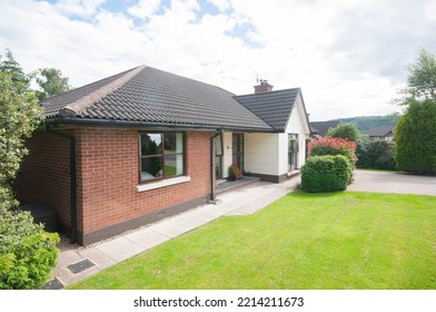 Front of a Modern bungalow with garden - Shutterstock ID 2214211673