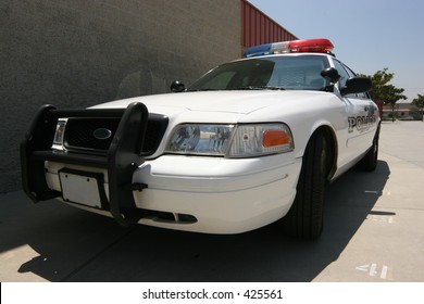 Front Of Modern Police Car Guarding Campus